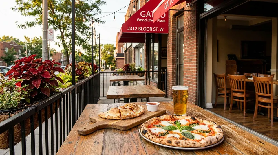 Enjoying fresh wood-fired pizza, calzone, and cold beer on the sunny patio at Gatto Wood Oven Pizza.